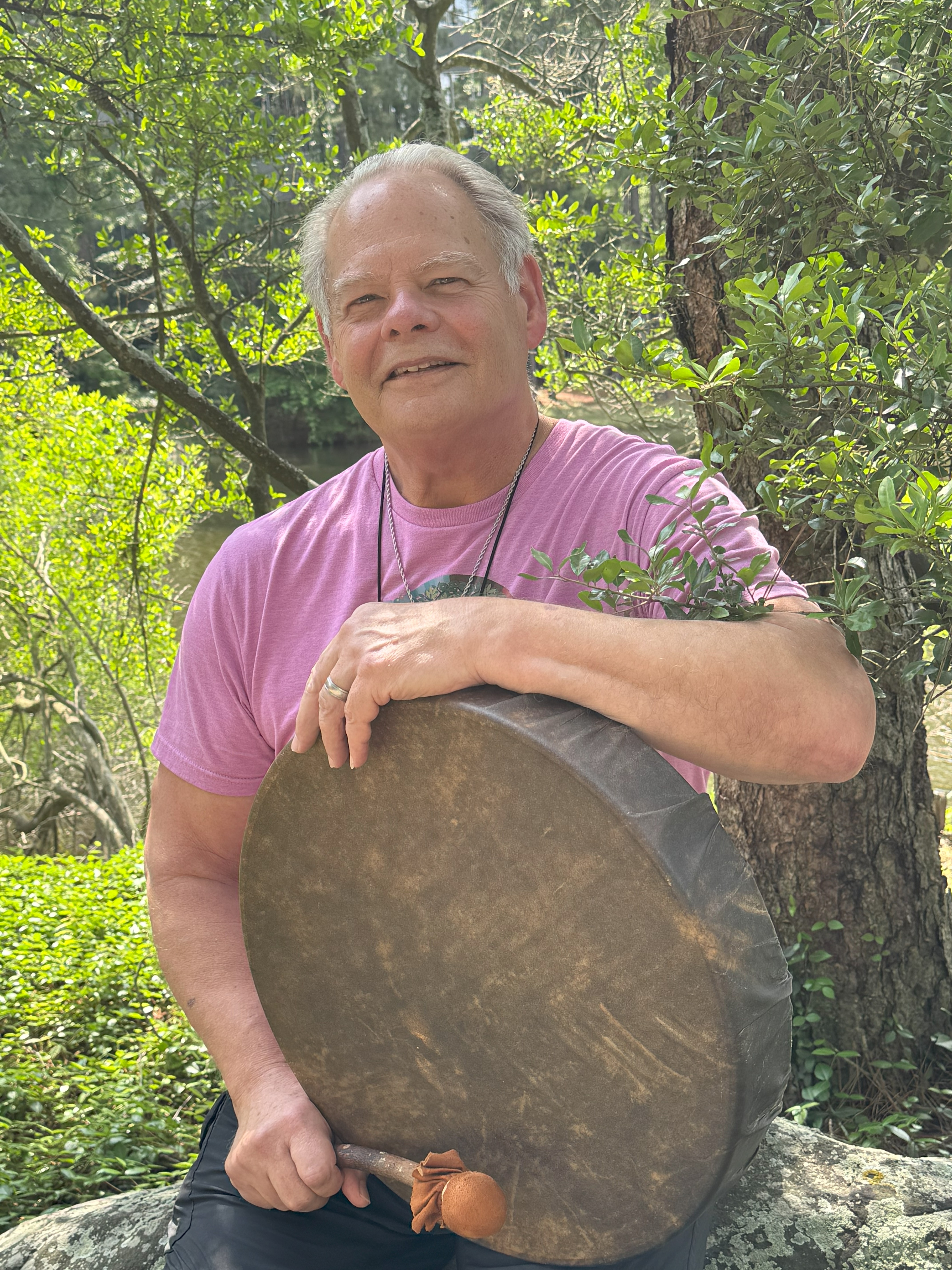 Randy Lovelace seated with his ceremonial drum